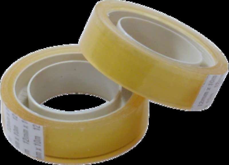 Two rolls of clear adhesive tape with white labels on a black background. — Cinta PNG