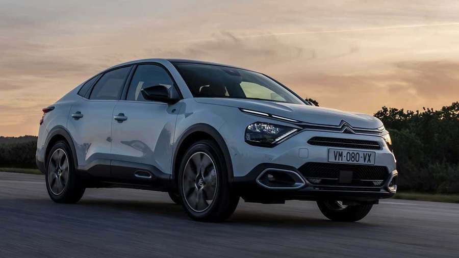 Silver Citroën C5 Aircross SUV driving on road at sunset. — Citroen Jumper Wallpaper