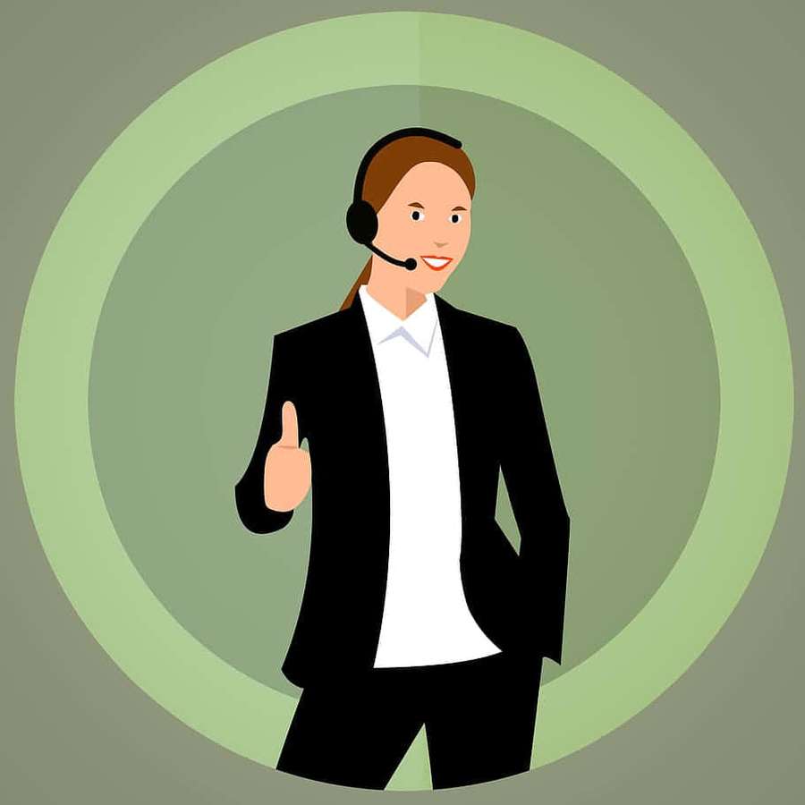 Agente de servicio al cliente con traje y auriculares dando pulgar hacia arriba. — Cliente Fondos de pantalla