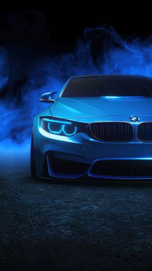Auto deportivo BMW azul con faros brillantes en ambiente nocturno ahumado. — Coche azul Fondos de pantalla
