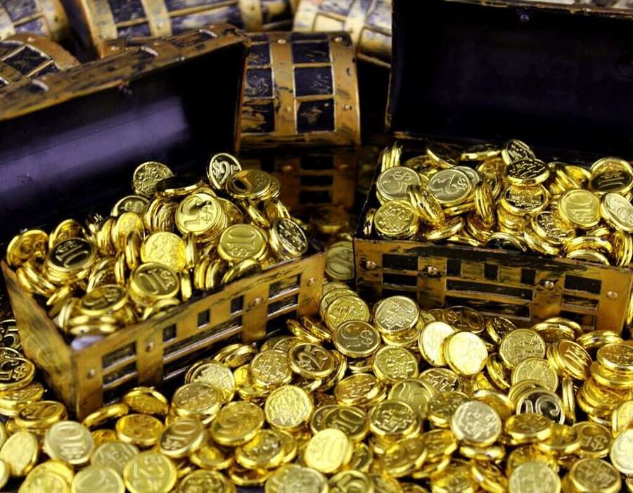 Open chests filled with golden coins spilling out onto a surface. — Coin Picture