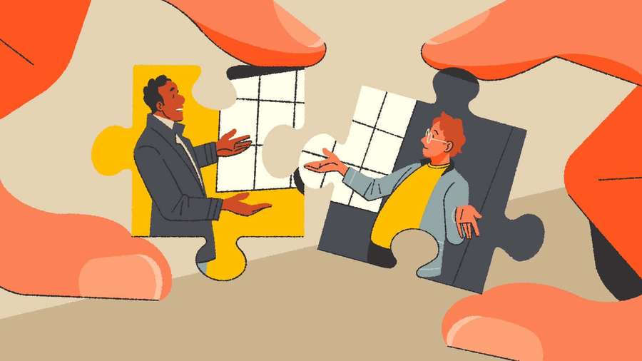 Two people in puzzle pieces connecting under giant hands — Communication Picture
