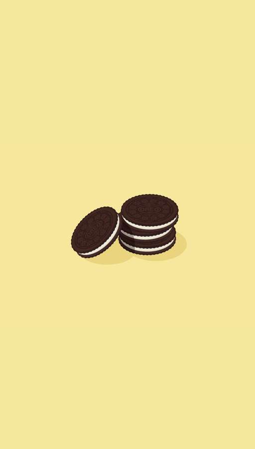 Stacked chocolate cookies with white cream filling on a yellow background. — Cookie iPhone Wallpaper