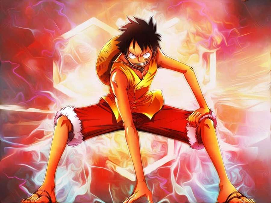 Anime-Charakter mit feuriger Energie, die in einer kraftvollen Pose um ihn herumwirbelt. — Cooler Ruffy Wallpaper
