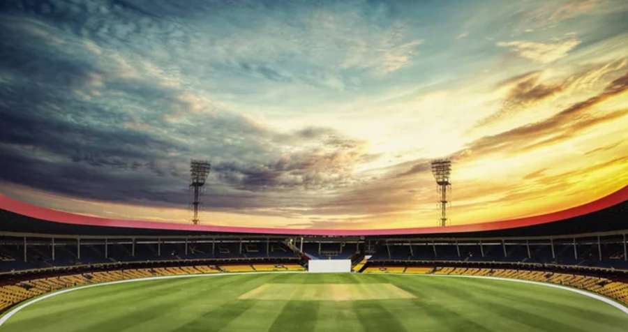 Cricket stadium at sunset with empty seats and dramatic sky — Cricket Ground Wallpaper