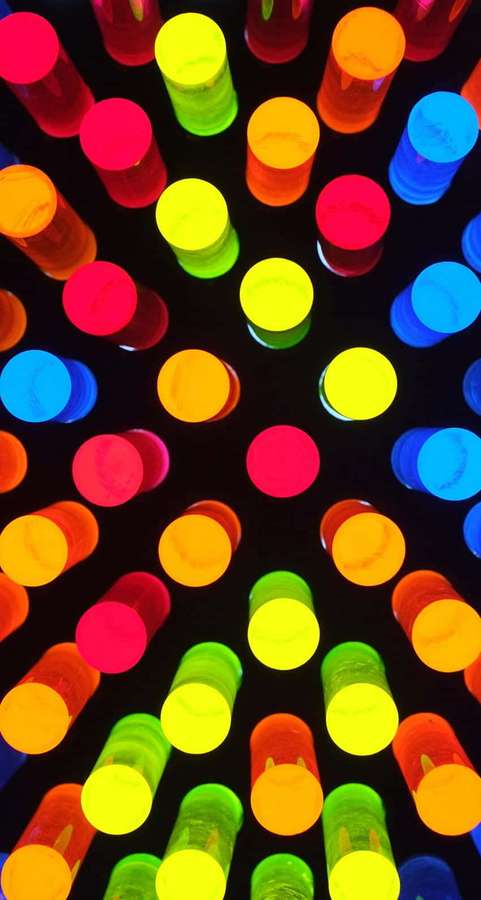 Neon colored cylinders arranged in a radial pattern glowing against black background — Custom iPhone 5s Dynamic Wallpaper