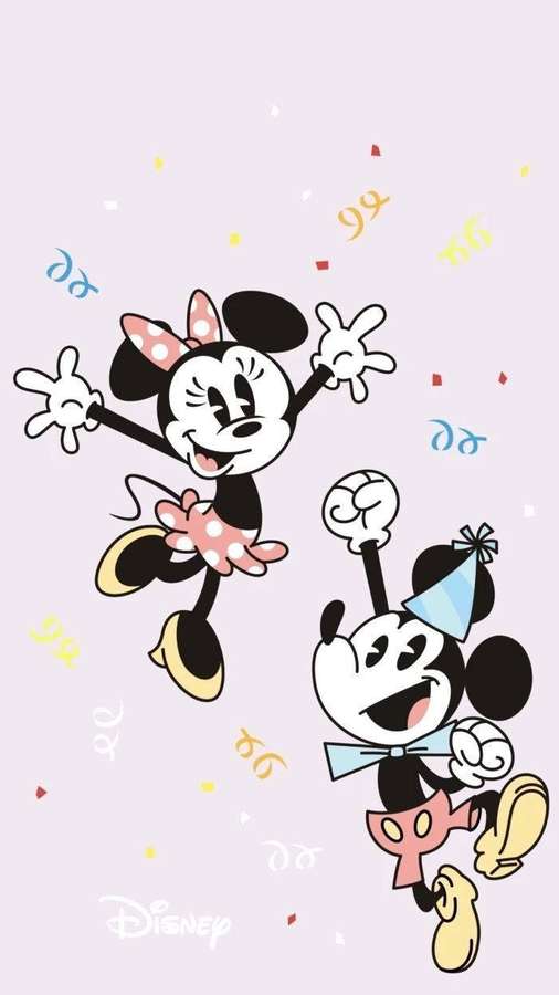 Mickey and Minnie Mouse dancing with confetti at a party. — Cute Disney Background
