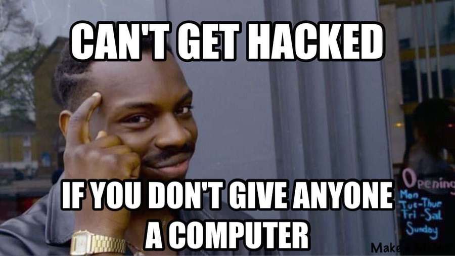 Man with finger to temple smiling with text about not getting hacked without computers. — Cybersecurity Memes Wallpaper