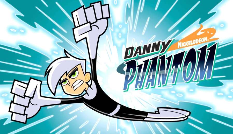 Danny Phantom flying forward with fists raised against a blue energy burst. — Danny Phantom Wallpaper