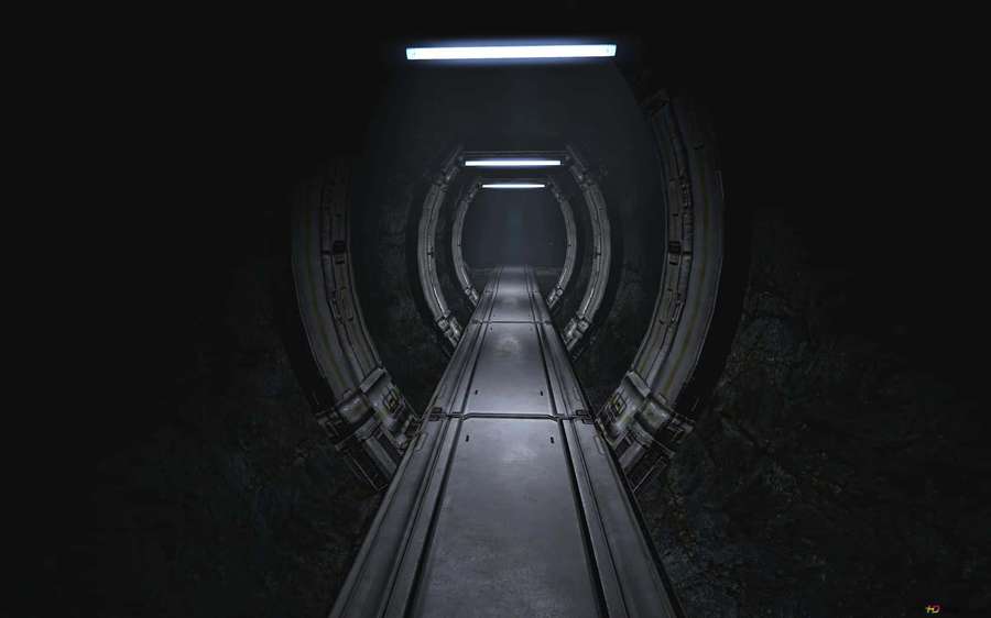 A dimly lit futuristic tunnel with glowing overhead lights and rocky walls. — Dark Underground Wallpaper