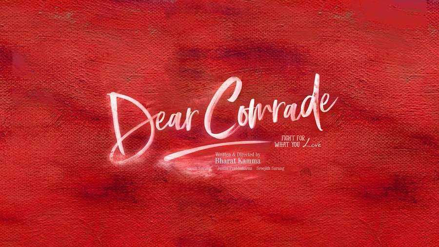 Movie title card for 'Dear Comrade' in white script on red watercolor background. — Dear Comrade Wallpaper