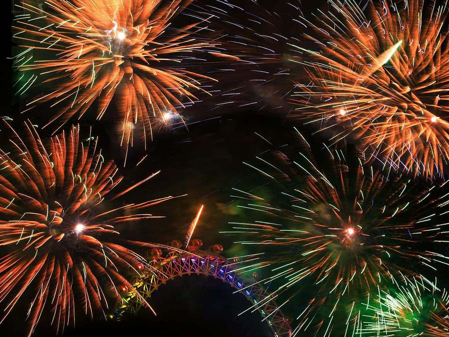 Vibrant_ Fireworks_ Display_ Over_ Bridge — Decades Wallpaper