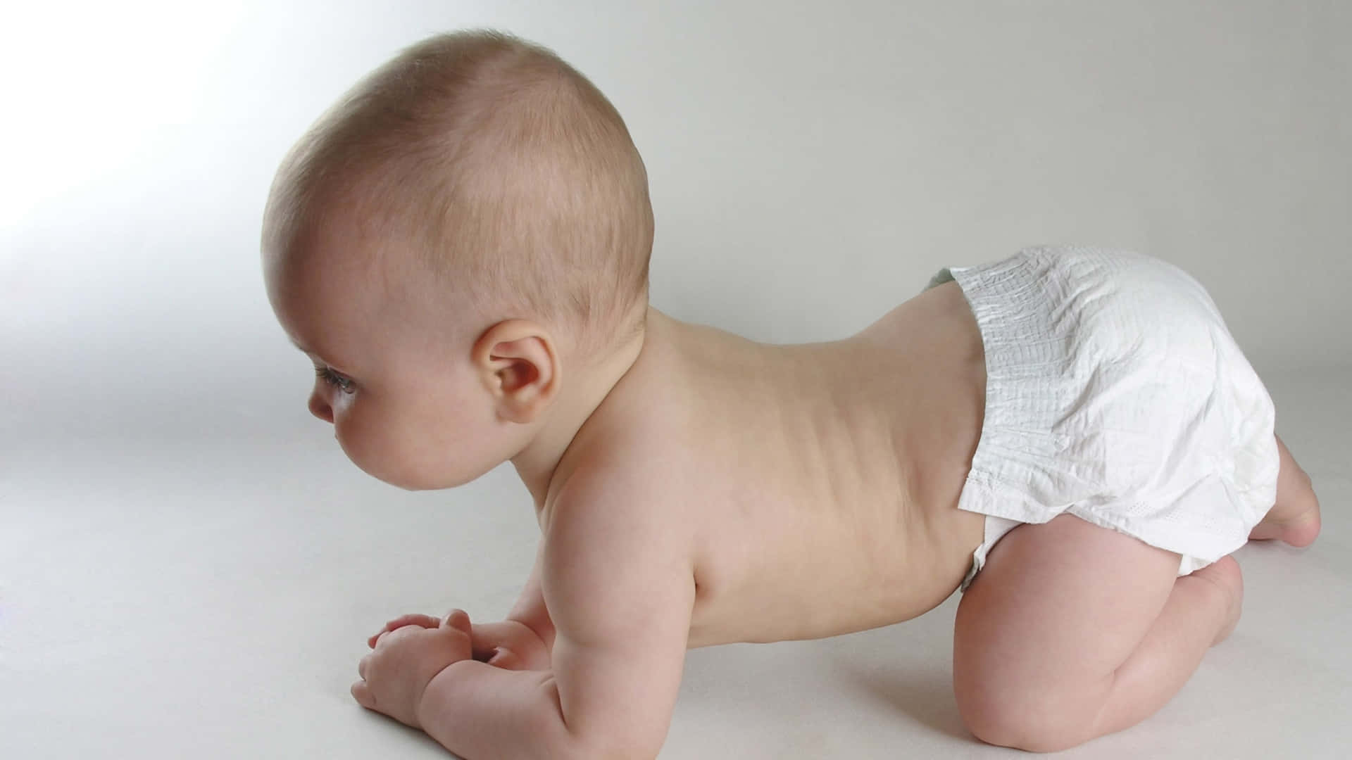 1600 Baby Standing In Diaper Stock Photos Pictures  RoyaltyFree Images   iStock  Baby crawling