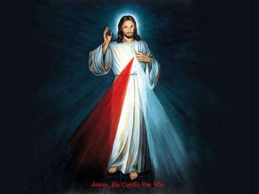Jesucristo con símbolo de corazón radiante en vestiduras blancas y rojas sobre fondo azul oscuro. — Dios Laptop Fondos de pantalla