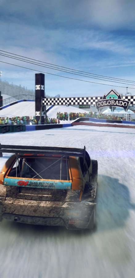 Race car speeding on snowy track with crowd and checkered flag. — Dirt Showdown Background