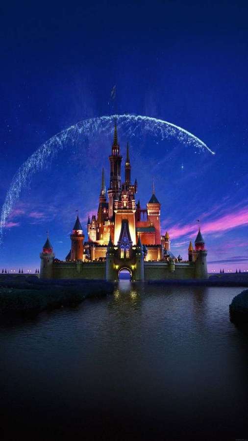 A glowing castle at night with a magical arc of light above it. — Disney iPhone Background