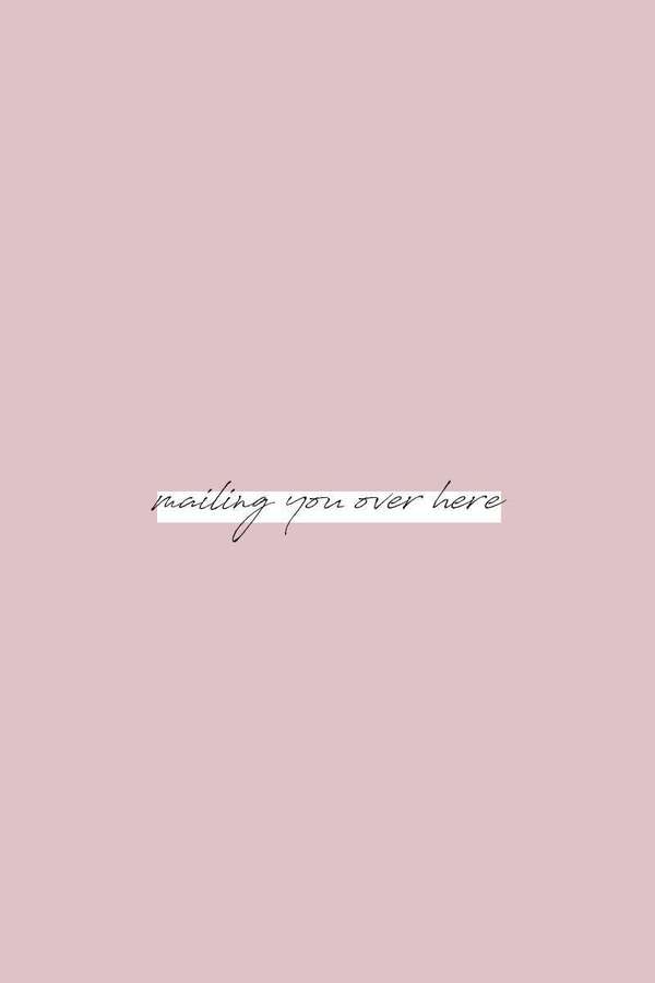 Pink background with centered cursive text saying mailing you over here — Distance Wallpaper