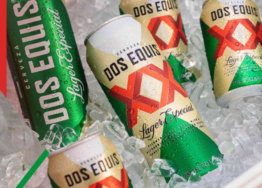 Chilled Dos Equis beer cans in ice for refreshment. — Dos Equis Wallpaper