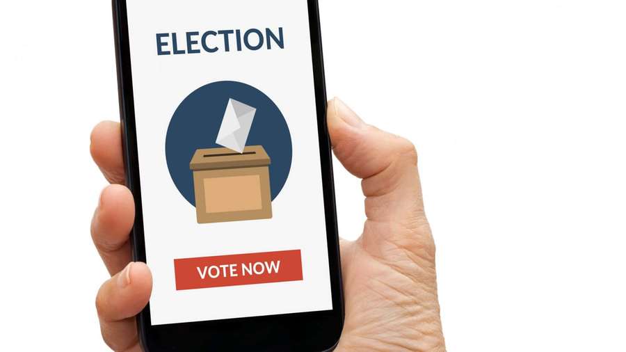 Hand holding phone with election voting app showing ballot box and vote now button. — Election Background