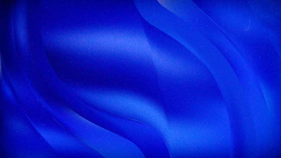 Abstract flowing blue fabric with soft gradients and subtle texture. — Electric Blue Wallpaper