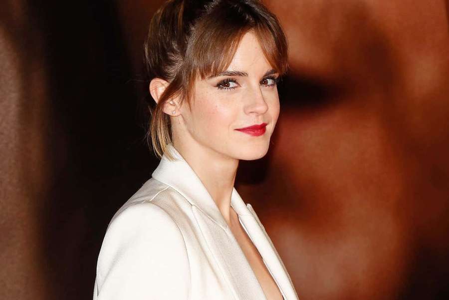 Emma Watson in white blazer with red lipstick smiling softly. — Emma Watson Picture