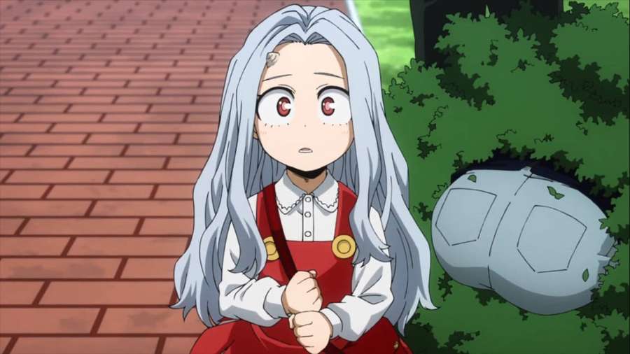 A surprised anime girl with silver hair sits on a brick path beside green bushes. — Eri Picture