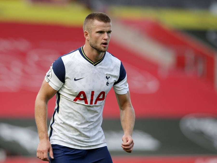 Football player in Tottenham kit running on stadium field — Eric dier Wallpaper