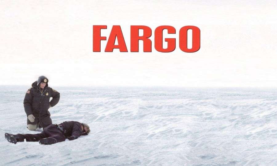 Police officer kneeling beside a body in snowy field with 'FARGO' text. — Fargo Wallpaper