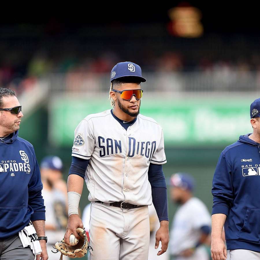 San Diego Padres baseball player walking on field with teammates — Fernando Tatis Jr Wallpaper