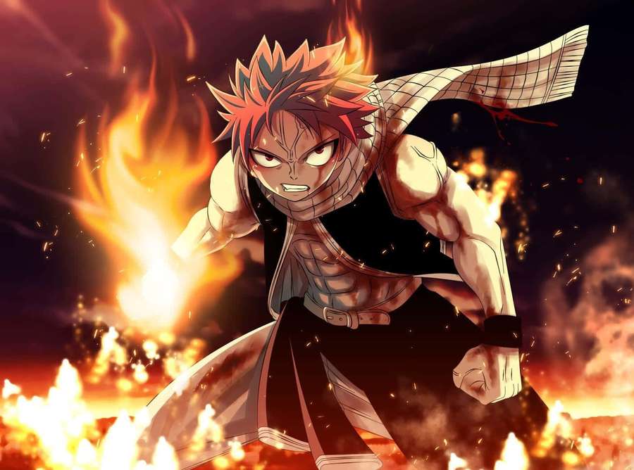 Anime character with fiery hair and scarf surrounded by flames in battle stance. — Fire Pfp Wallpaper