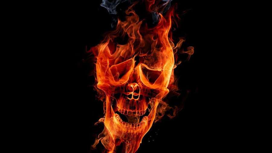 Flaming skull with bright orange fire against black background — Flaming Skull Background