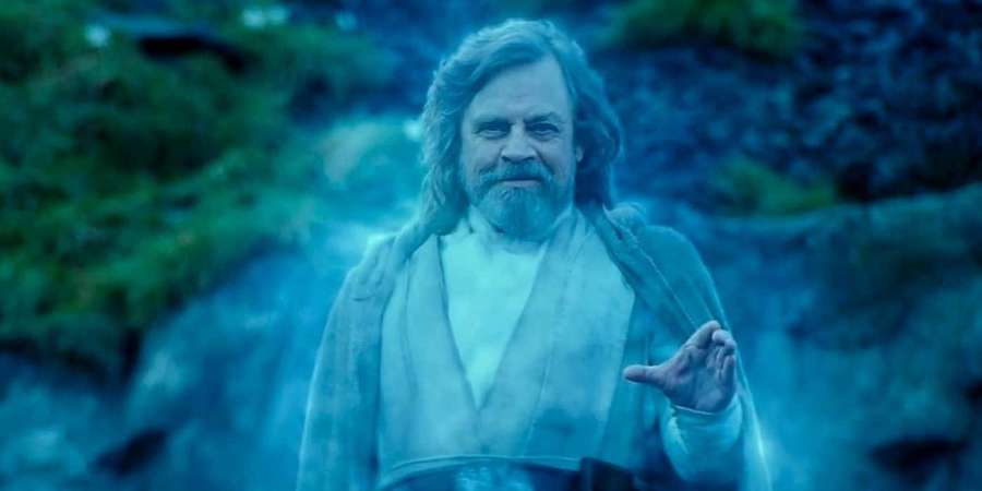 Luke Skywalker in a blue-lit forest with mist swirling around him. — Force Ghosts Wallpaper