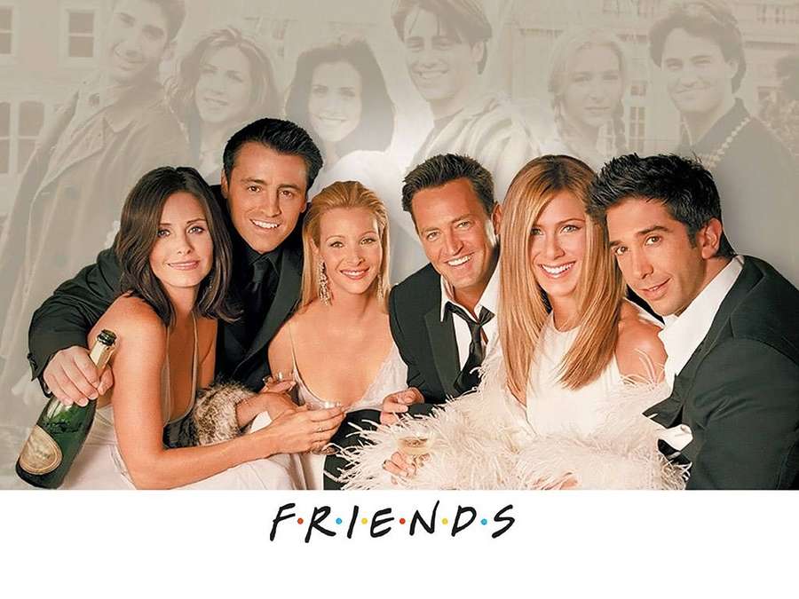 Six actors from the TV show Friends in formal attire holding champagne and posing together. — Friends Desktop Wallpaper