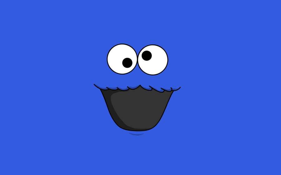 A cartoon blue monster with big eyes and a wide smile. — Funny Laptop Wallpaper