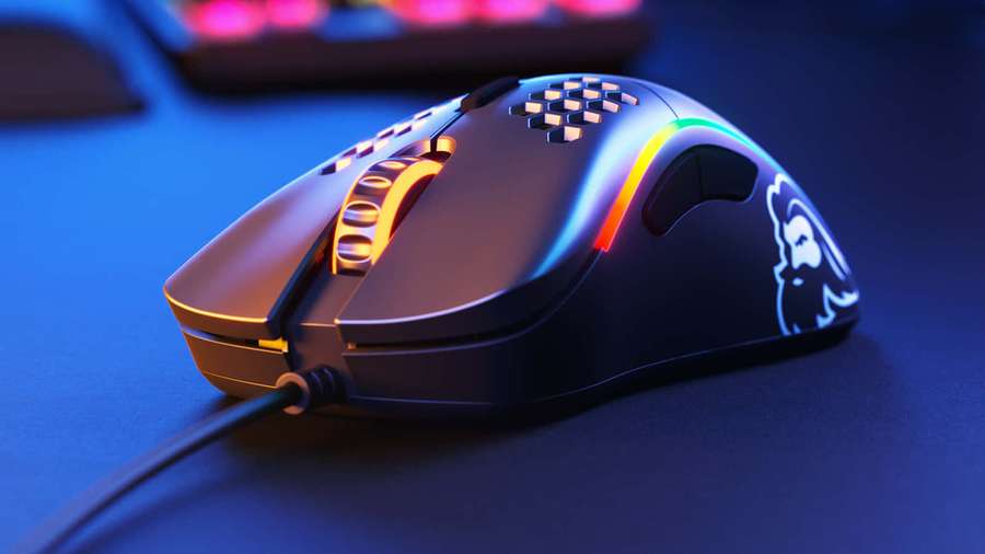 Gaming mouse with rainbow lights on a blue desk — Gaming Mice Wallpaper