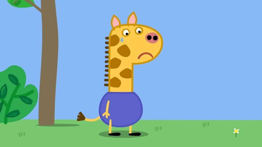 A cartoon giraffe wearing a purple shirt looks sad with a tear on its cheek near a tree. — Gerald Giraffe Wallpaper
