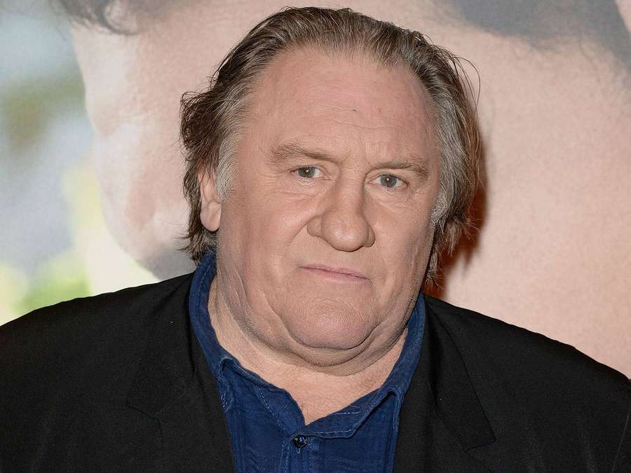 Man in black blazer and blue shirt at event — Gérard Depardieu Wallpaper