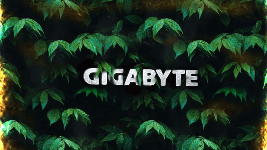 GIGABYTE logo surrounded by green leaves and orange flames. — Gigabyte Wallpaper