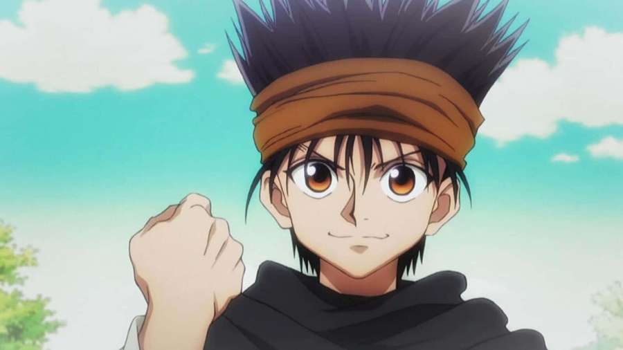 Anime character with spiky black hair and brown eyes clenches fist outdoors under blue sky. — Ging Freecss Wallpaper