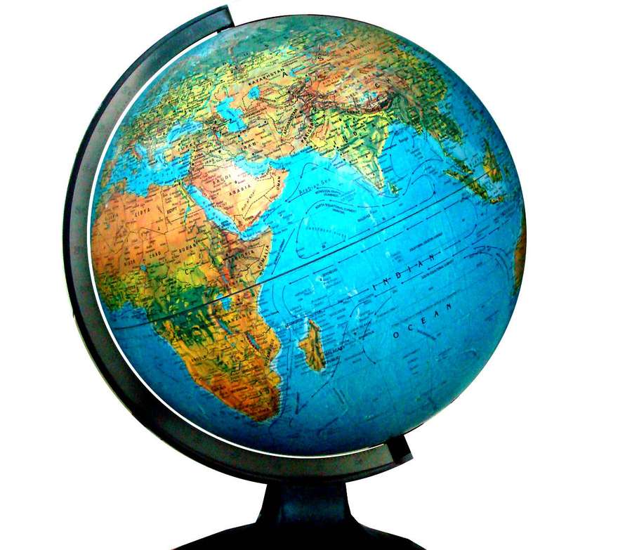 A classic globe showing continents and oceans on a white background. — Globe Map Background