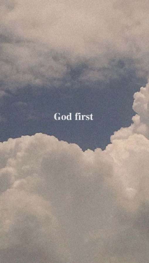 Text 'God first' over a cloudy sky with blue patches. — God First Wallpaper