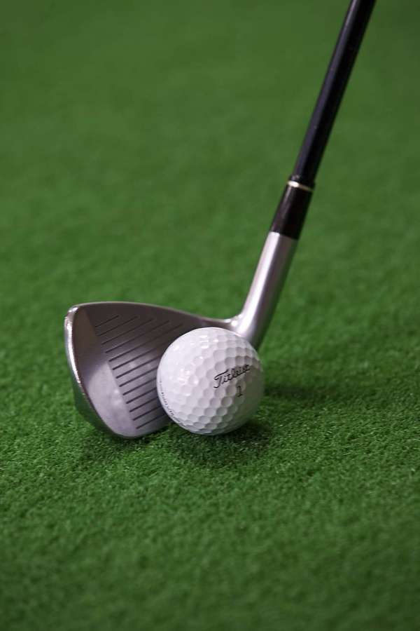 Golf club and ball on green grass — Golf Phone Wallpaper