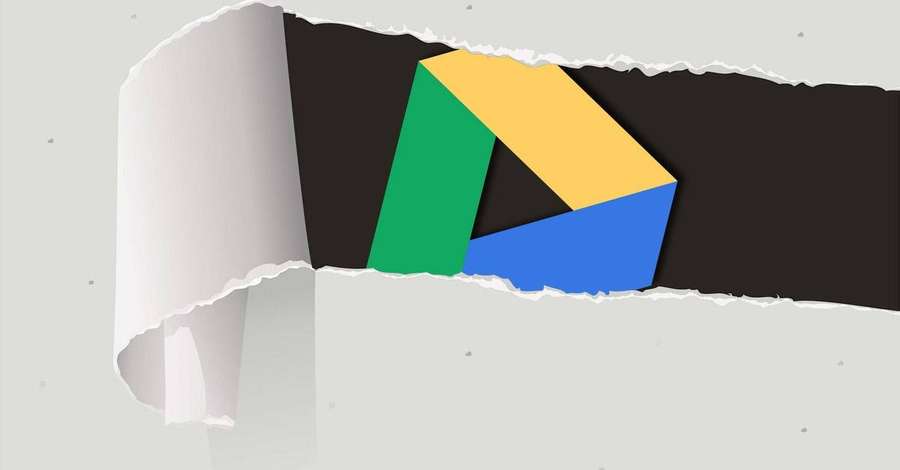 Torn paper reveals Google Play logo against black background. — Google Drive Wallpaper