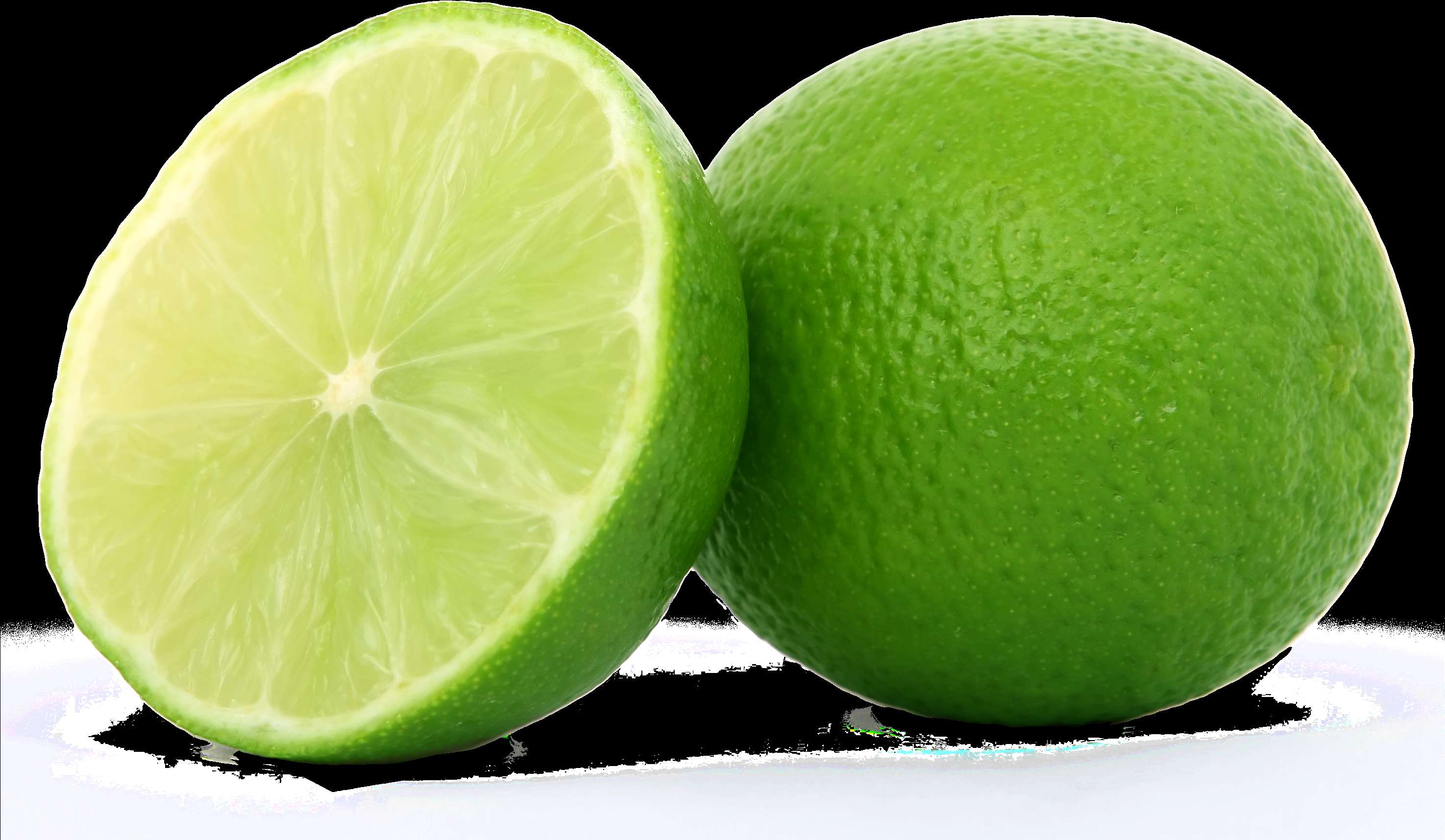 Two fresh green limes one cut in half on a white surface. — Green PNG