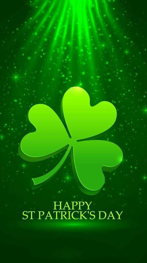 Ein leuchtendes vierblättriges Kleeblatt mit funkelndem grünem Licht und happy st patricks day Text. — Grüne Blätter Wallpaper
