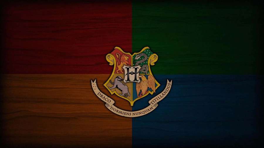 Hogwarts school crest on a wood-textured background with colored quadrants. — Gryffindor Background