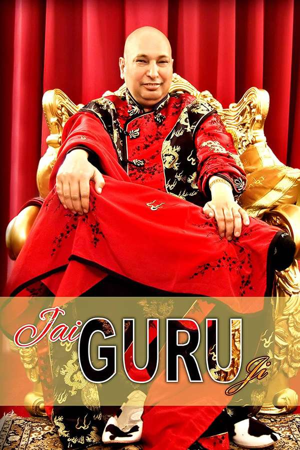 Man in red and gold robes seated on ornate golden throne with red curtain backdrop. — Guru Ji Wallpaper
