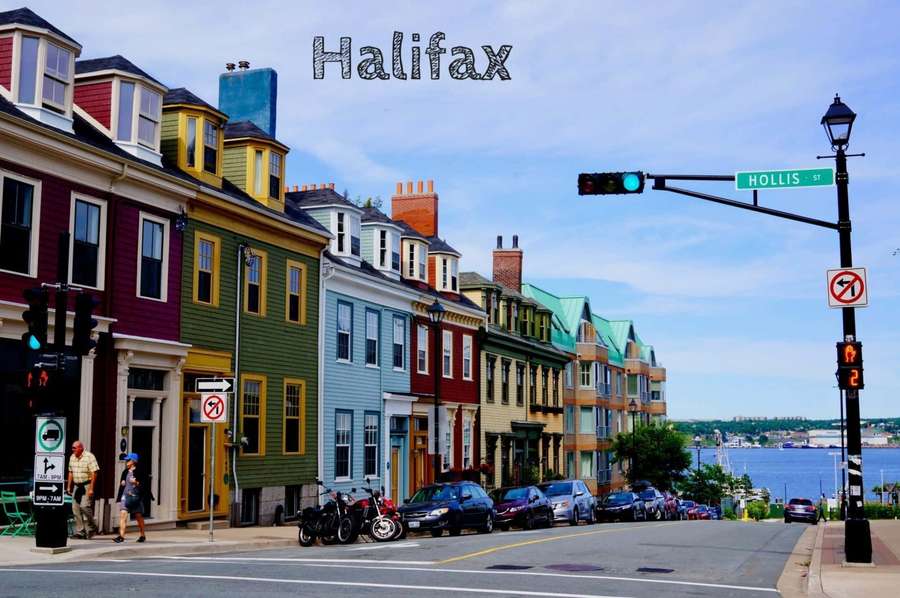 Colorful historic houses line a sunny urban street with waterfront view. — Halifax Canada Wallpaper
