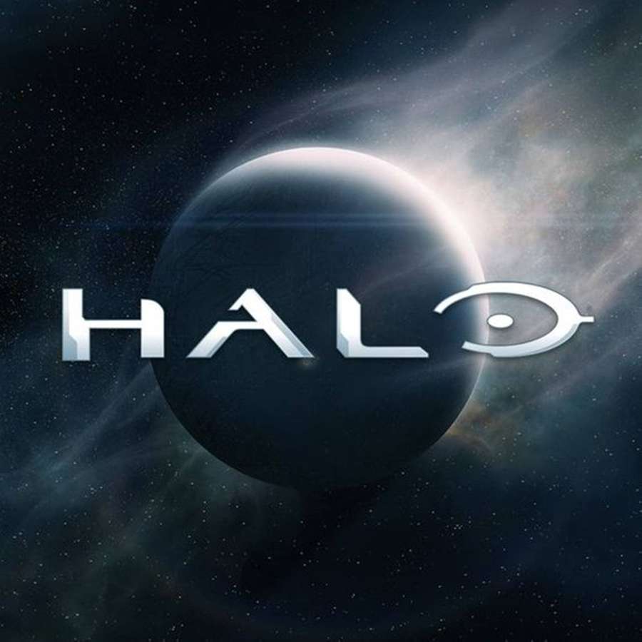 Halo logo floating in space near a planet with stars and nebulae. — Halo Logo Wallpaper