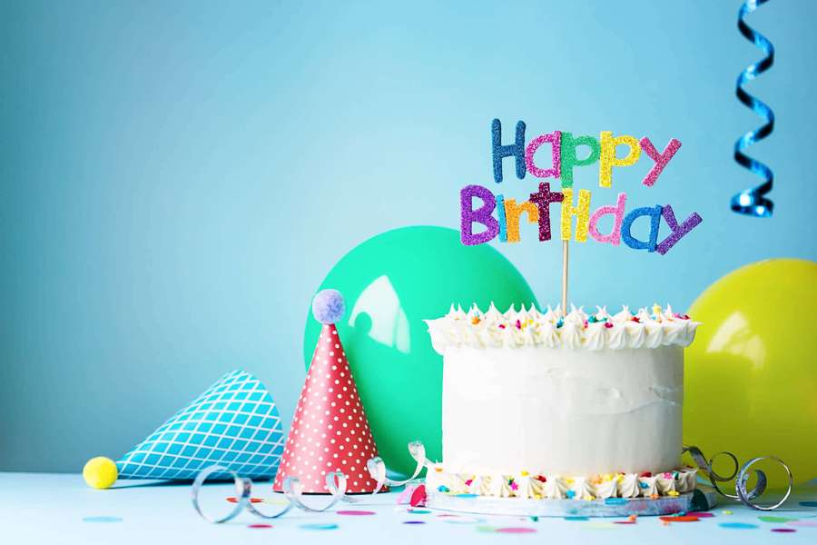 Birthday cake with decorations and balloons on a blue background. — Happy Birthday Background